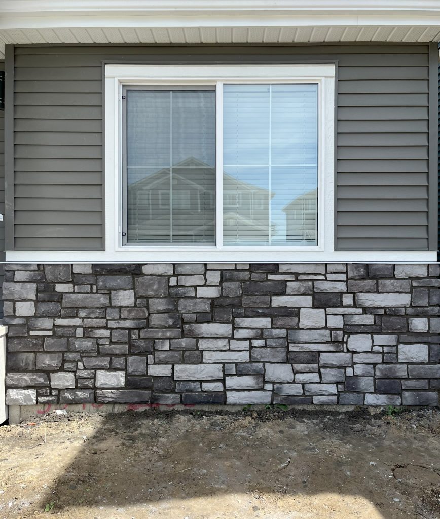 YEG Exteriors finished stonework and parging project in Edmonton